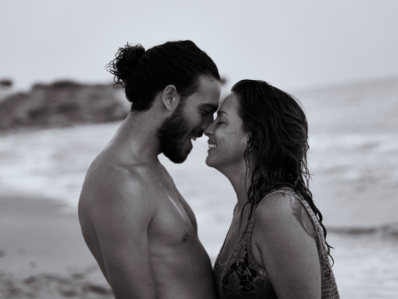 Monika and Alessio sharing a joyful moment together on the beach in Sicily.